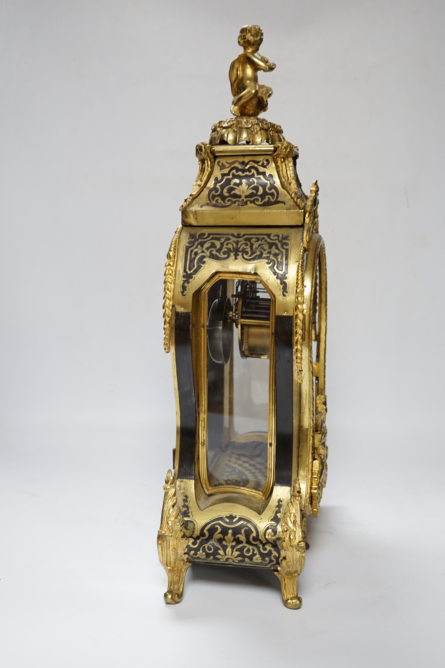 A large Louis XV style cut brass inlaid mantel clock, with a two train, French movement, striking on a bell, 50cm high